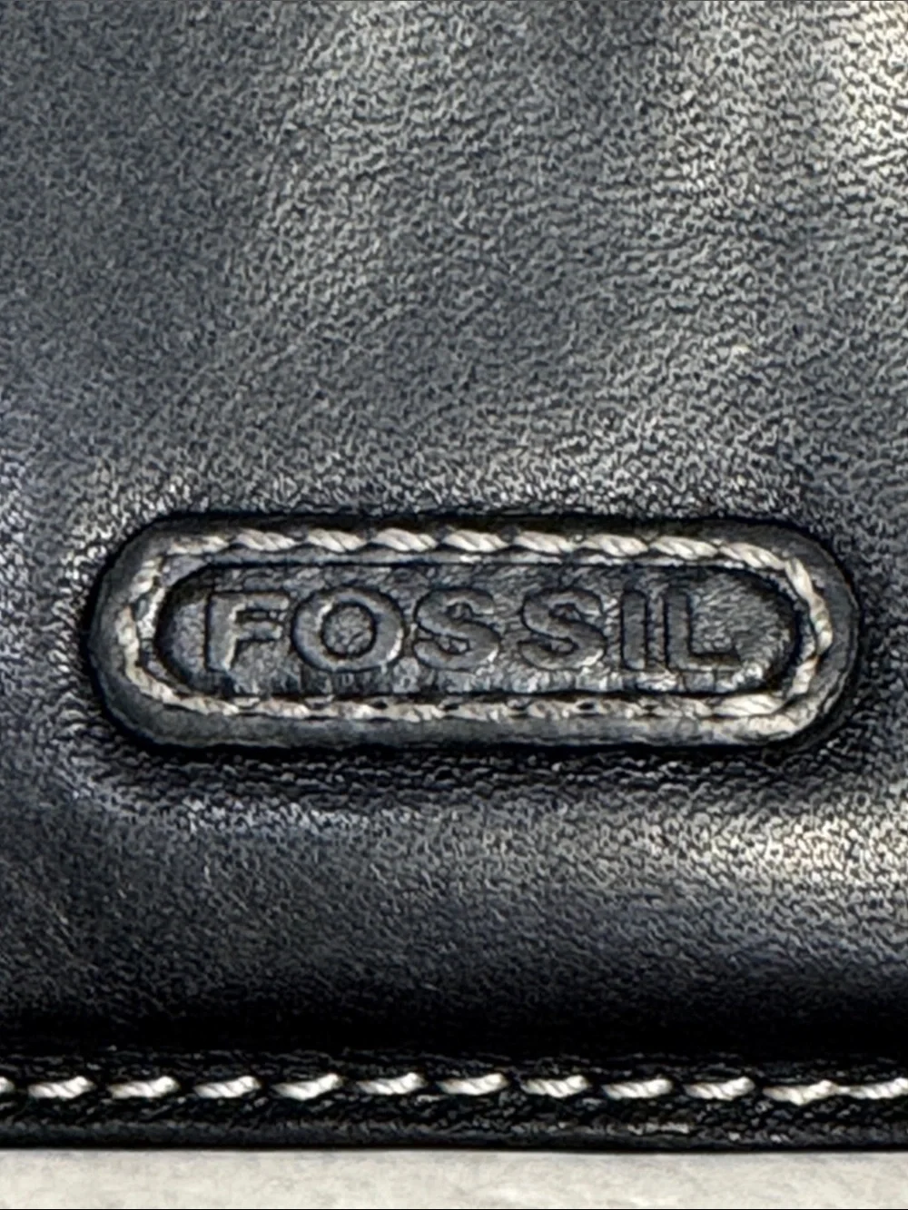 Fossil black leather mini wallet.